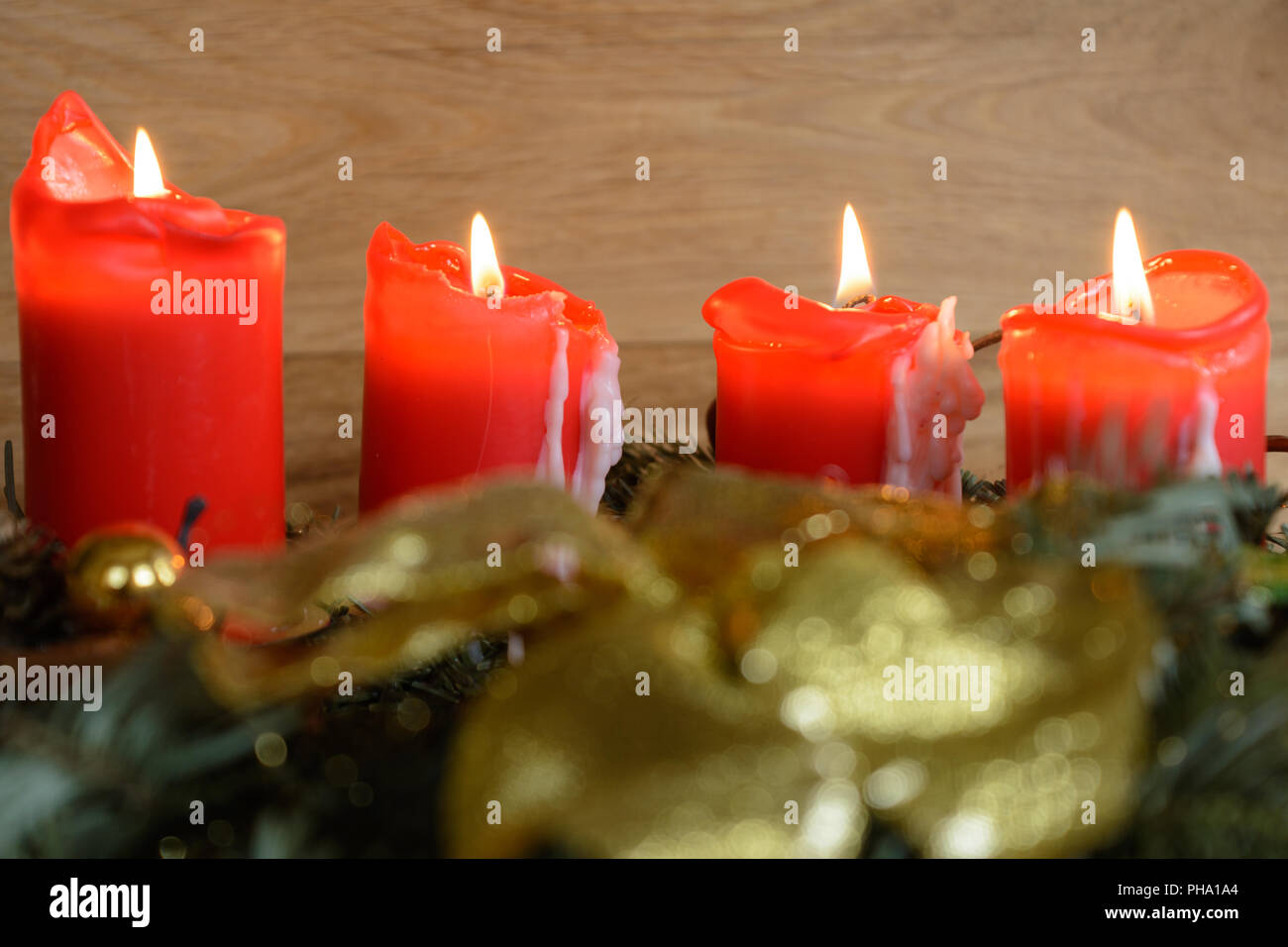 All four candles of the Advent wreath burn - close-up Stock Photo