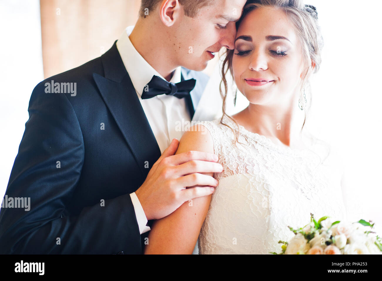 Close up portrait of wedding couple at gentle touch Stock Photo