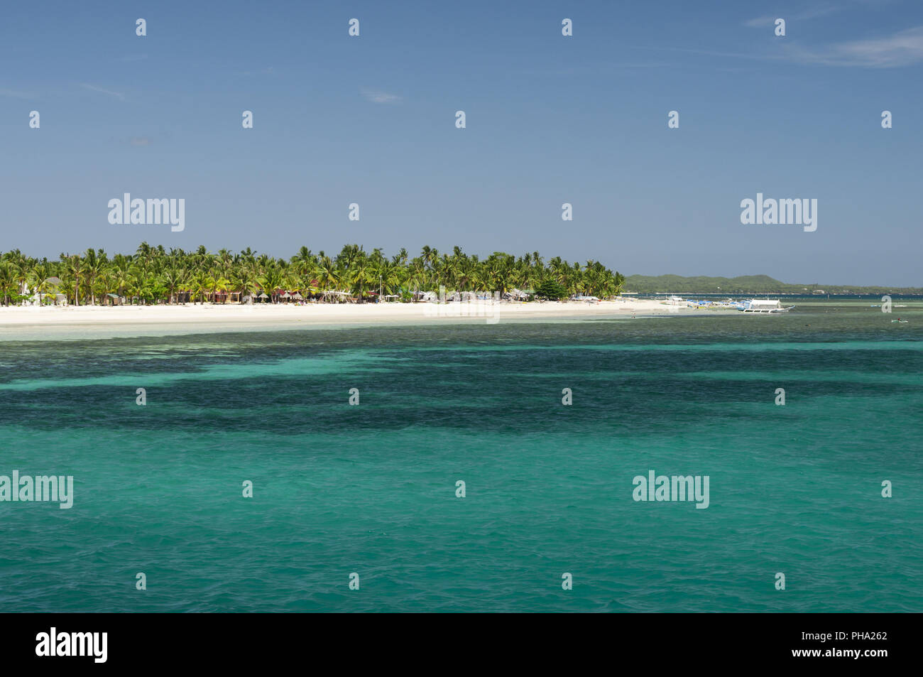 Blue sea with greener tropical island, Philippines Stock Photo - Alamy
