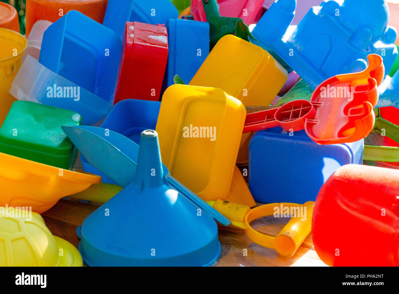 A close up of kids colourful plastic toys that have been washed drying