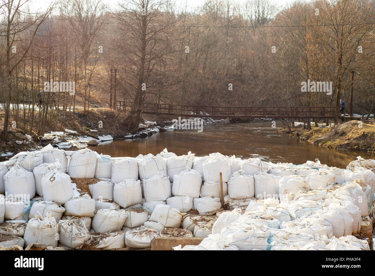 Lot of big white sandbags for flood defense. Stock Photo