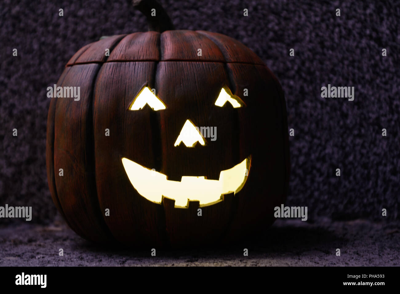 Decorative Halloween pumpkin with creepy lighting - close-up Stock Photo
