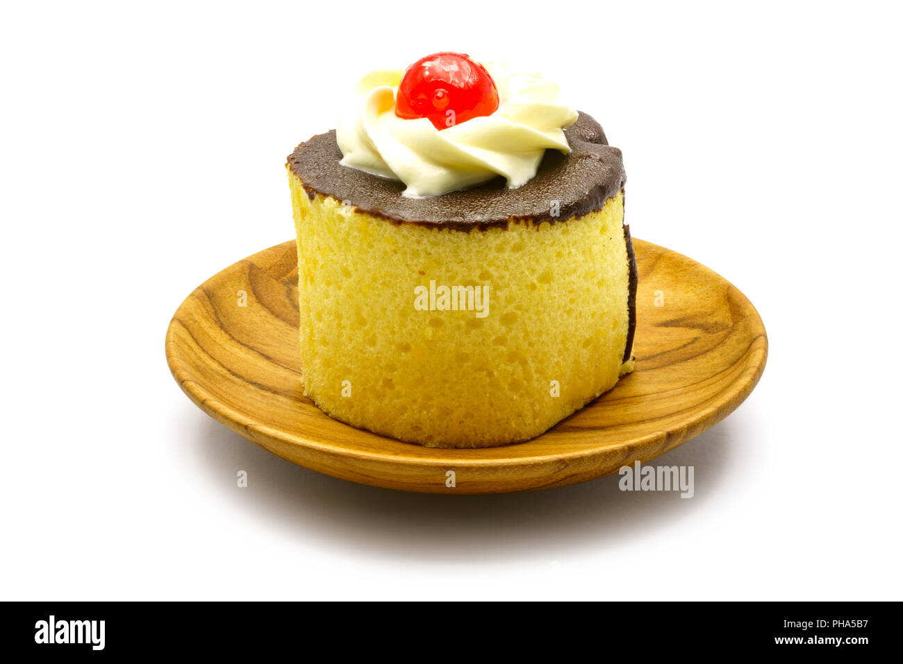 Cake garnished with cream and chocolate Stock Photo