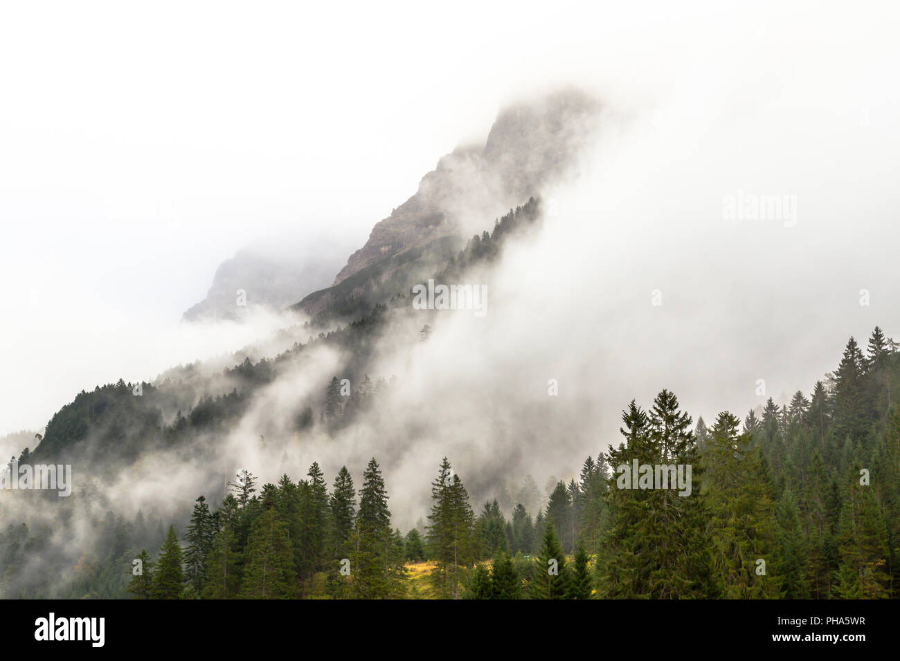 Mountain peaks in mist, Hinterhornbachtal, Austria Stock Photo