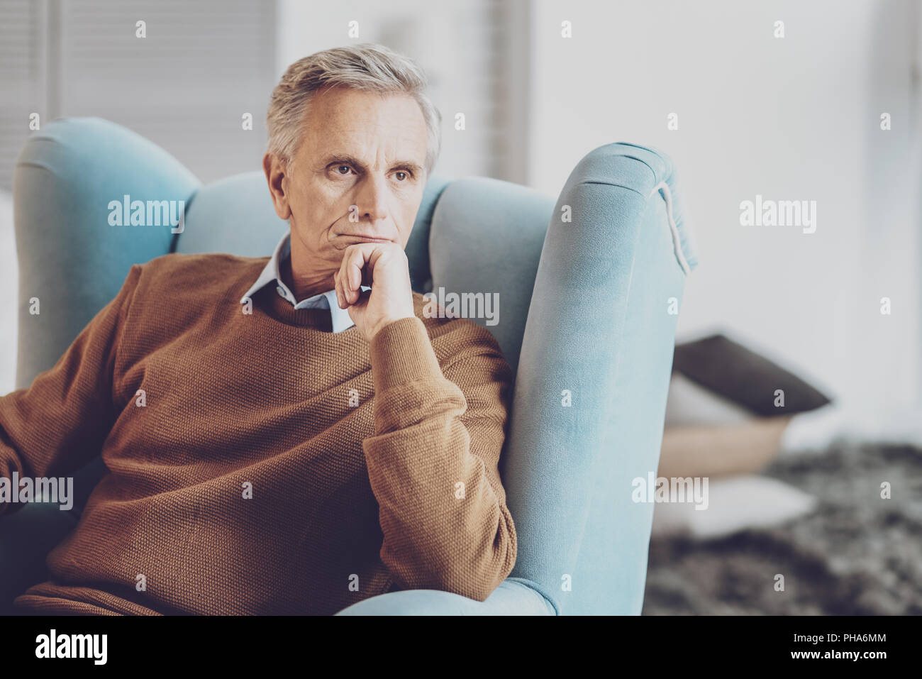 Attractive man being deep in thoughts Stock Photo Alamy