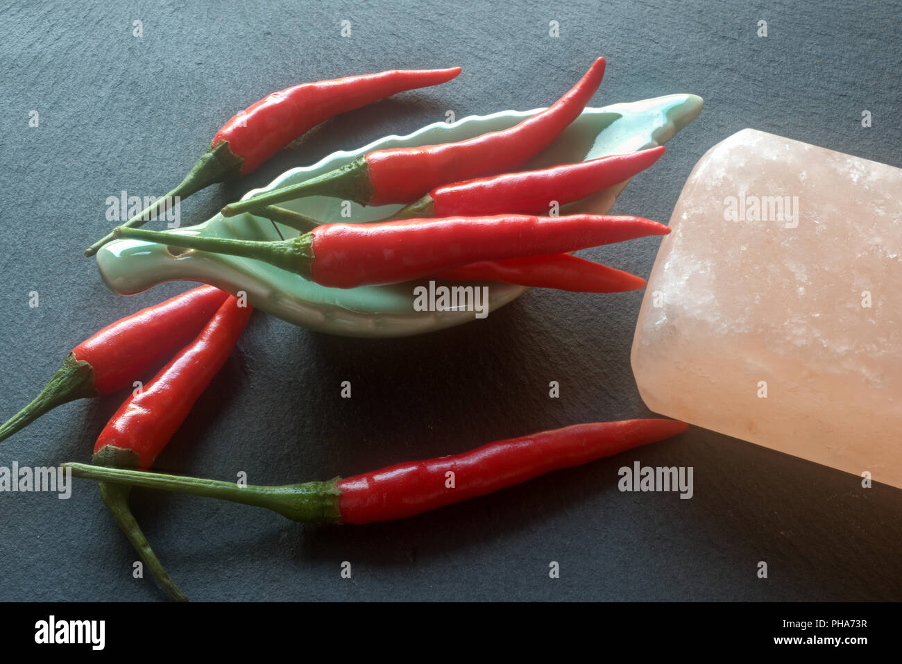 Chilis and rock salt Stock Photo
