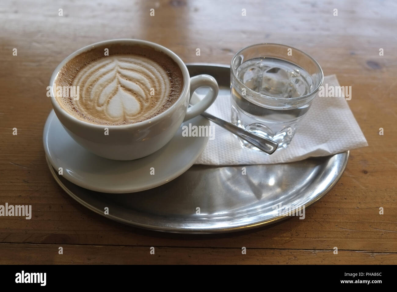 Serving tray with a cappuccino Stock Photo