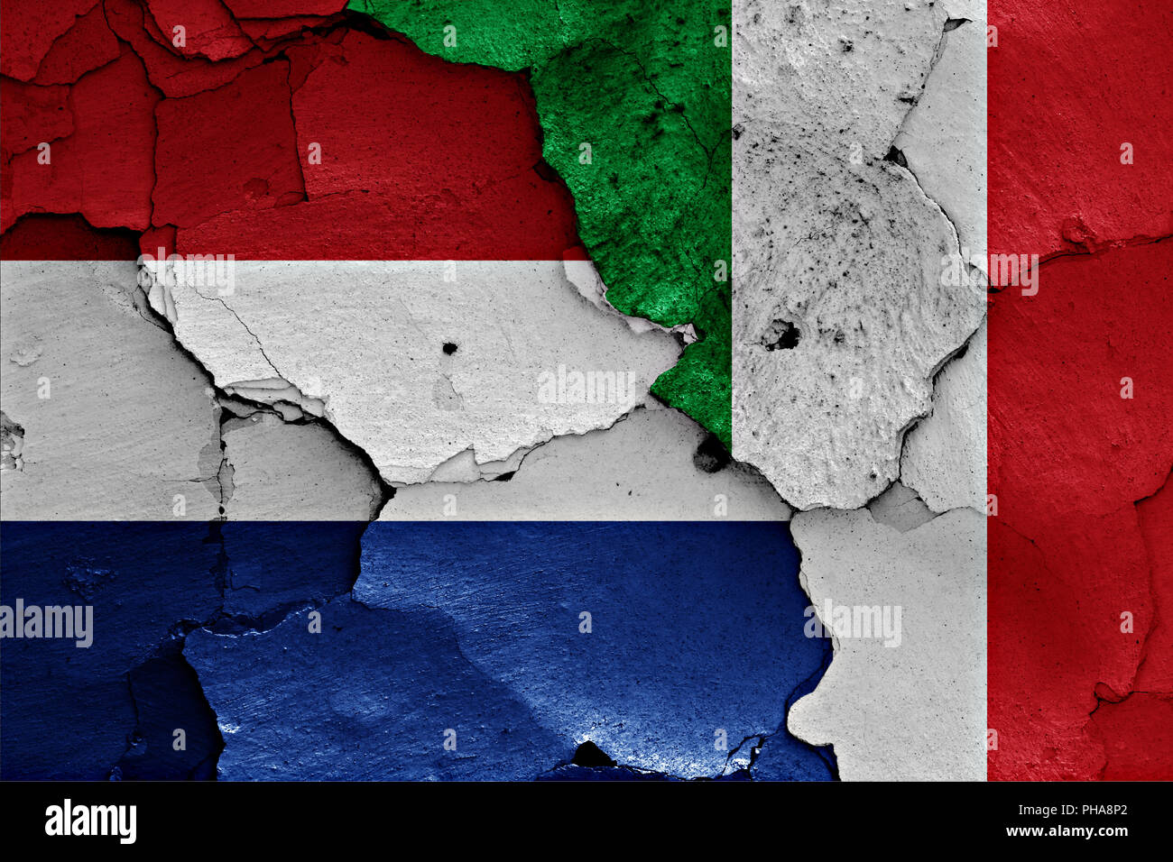 Flags of Netherlands and Italy  painted on cracked wall Stock Photo