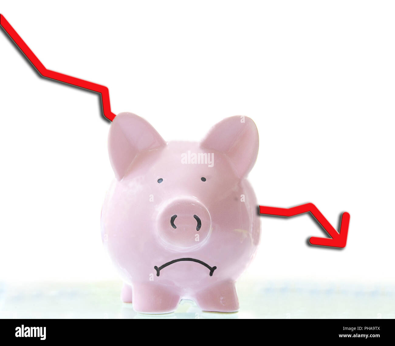 frowning pink piggy bank with down arrow Stock Photo