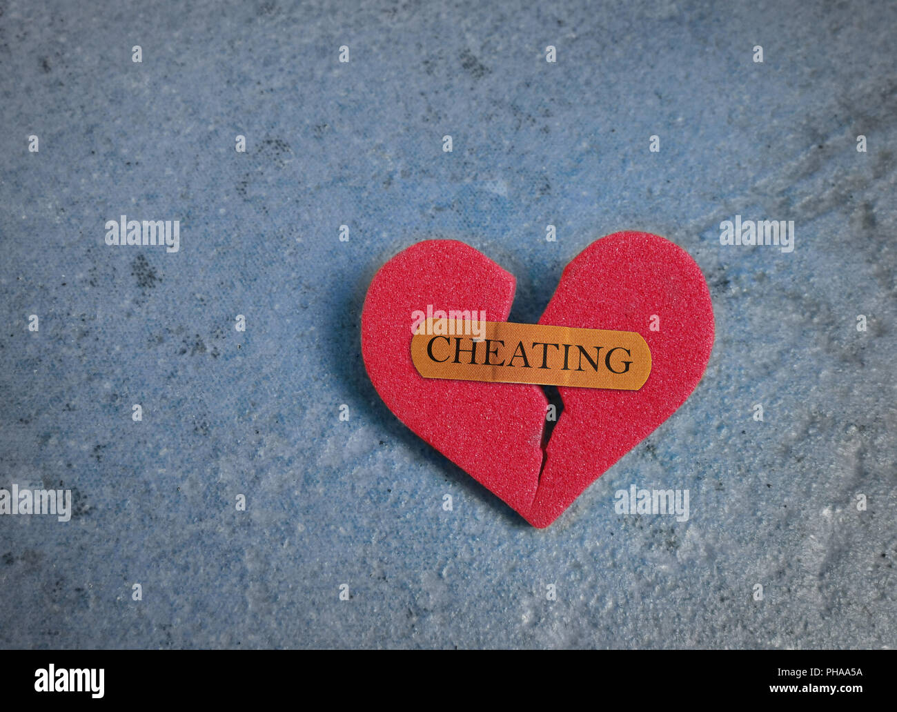 Broken red cheating heart Stock Photo
