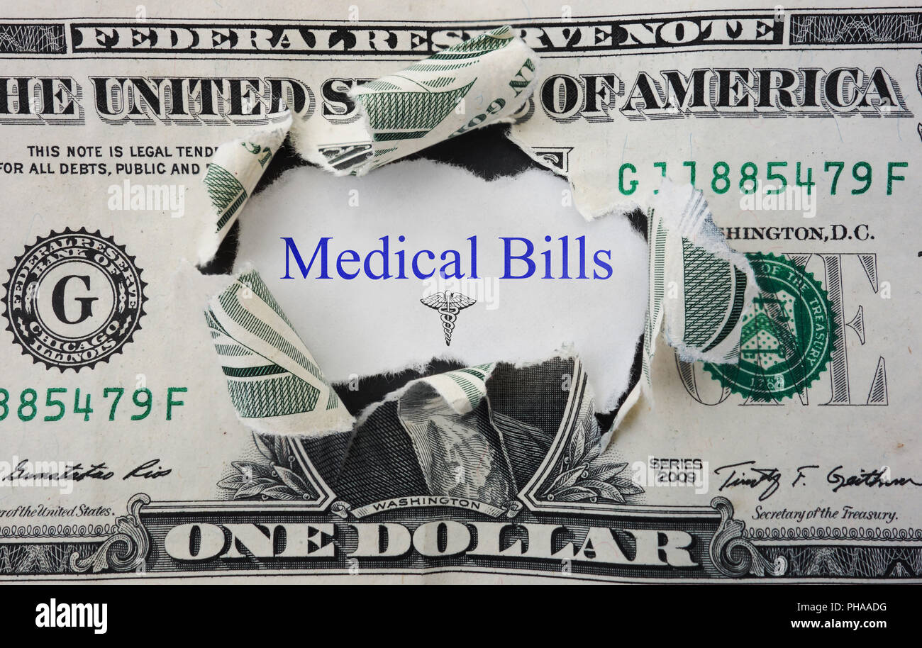 Medical Bills message with torn dollar bill Stock Photo Alamy