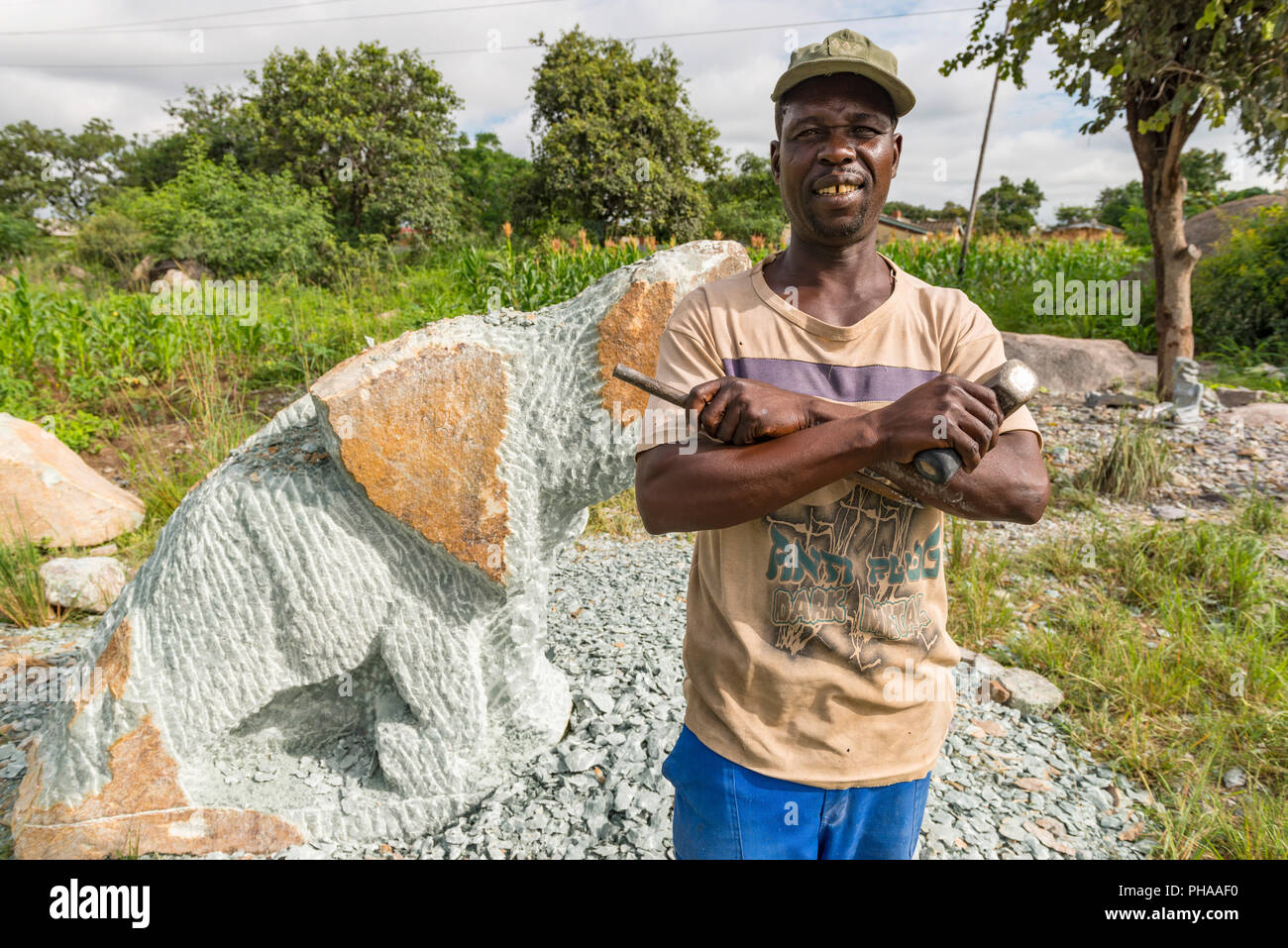 A stone carver seen in Harare, Zimbabwe Stock Photo