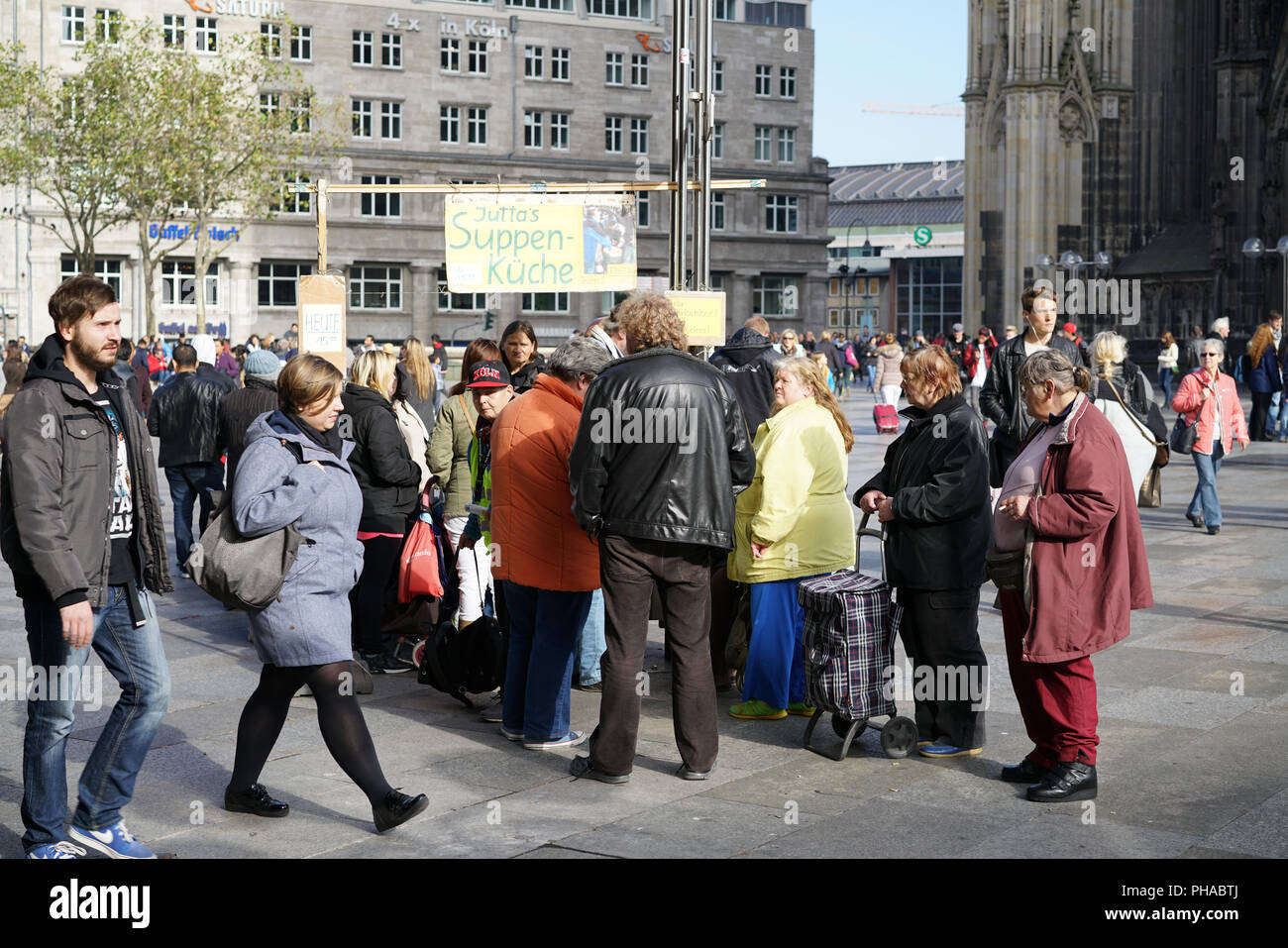 Distribution of food to the homeless in the city center of Cologne Stock Photo