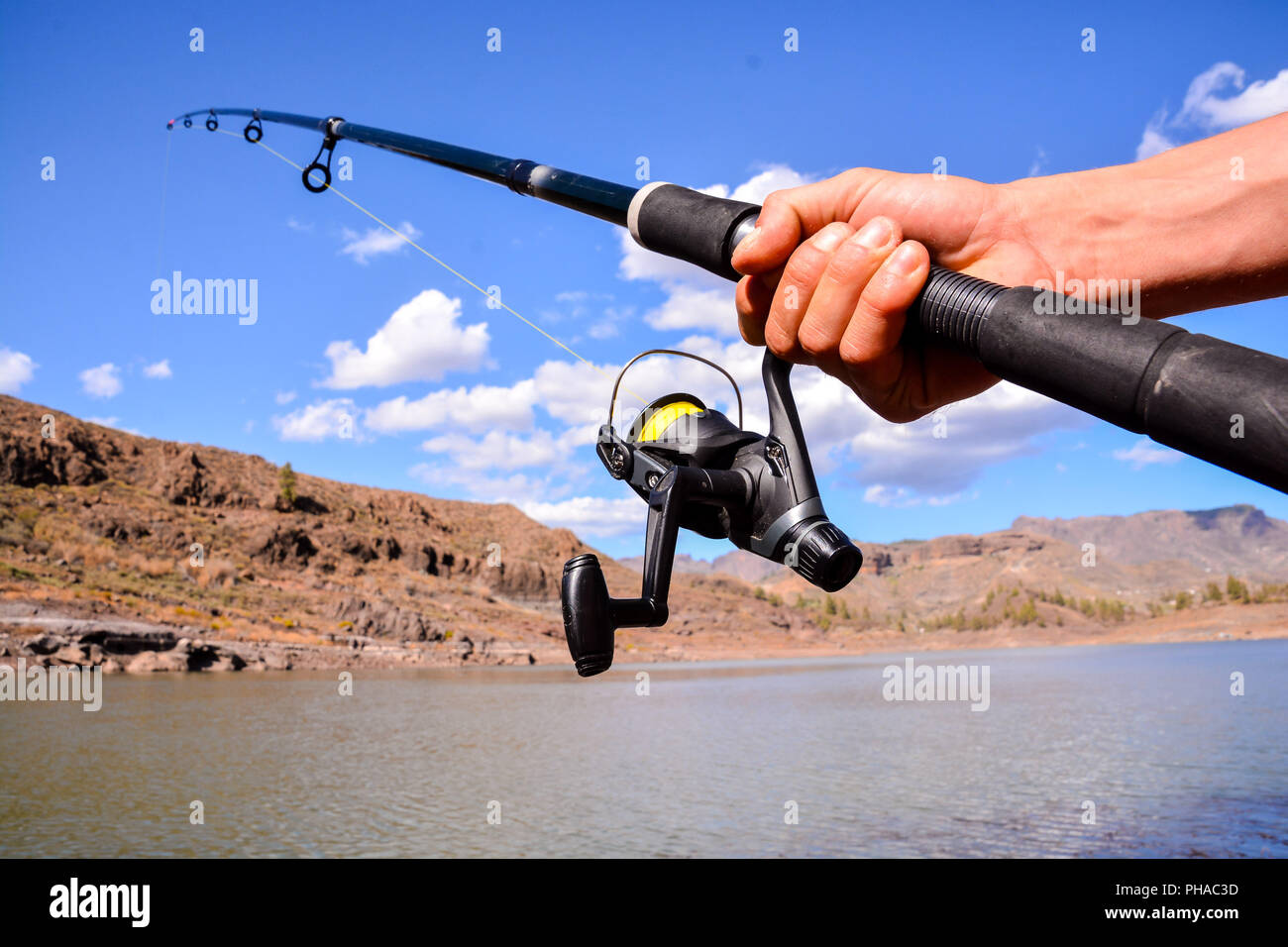 Fishing with rod on lake Stock Photo - Alamy