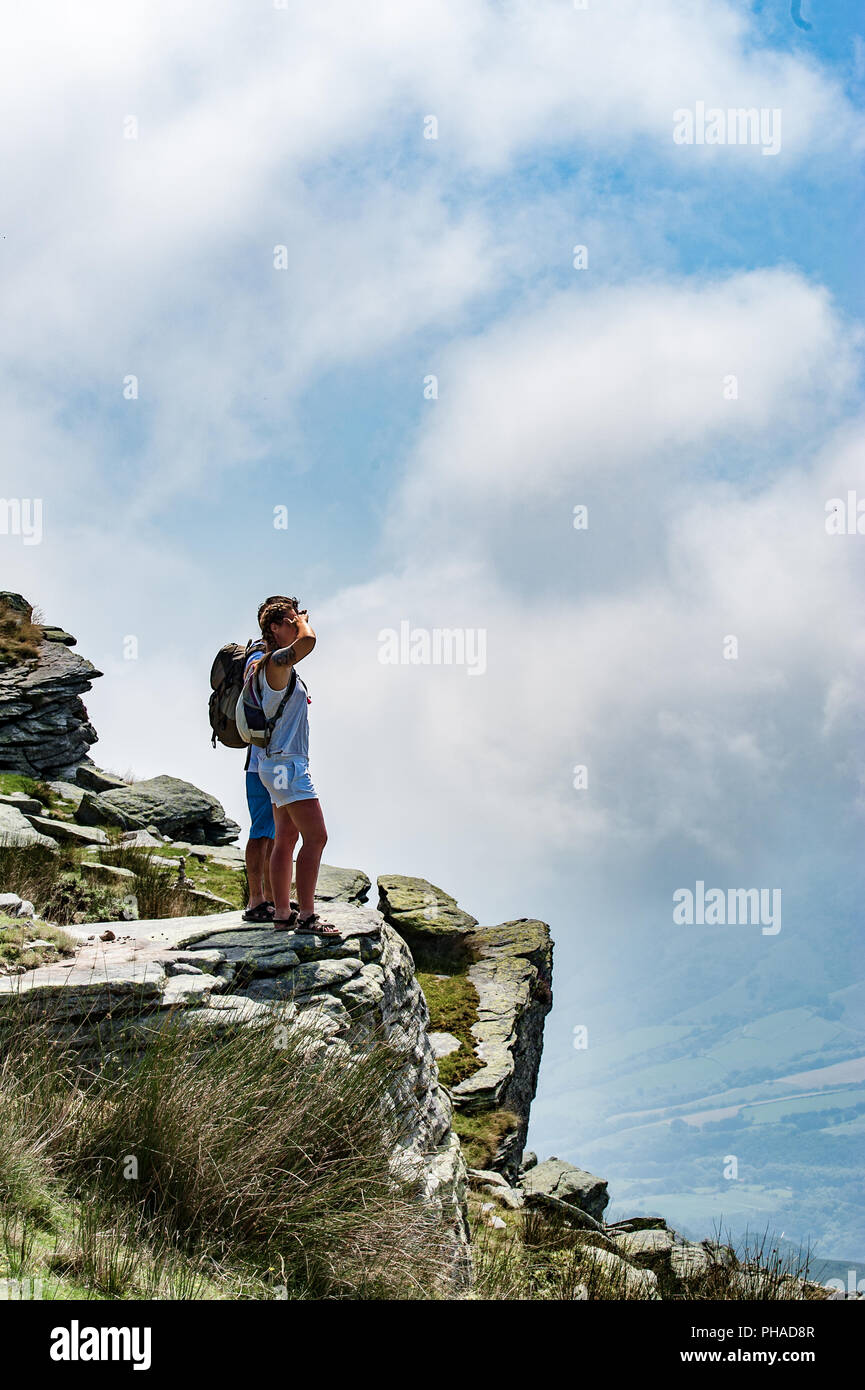 Young couple standing on a mountain top hi-res stock photography and ...