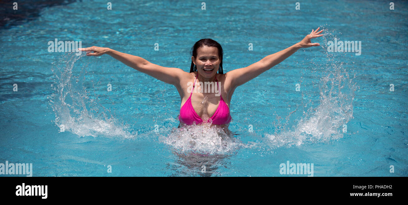 Woman in bikini at a pool hi-res stock photography and images