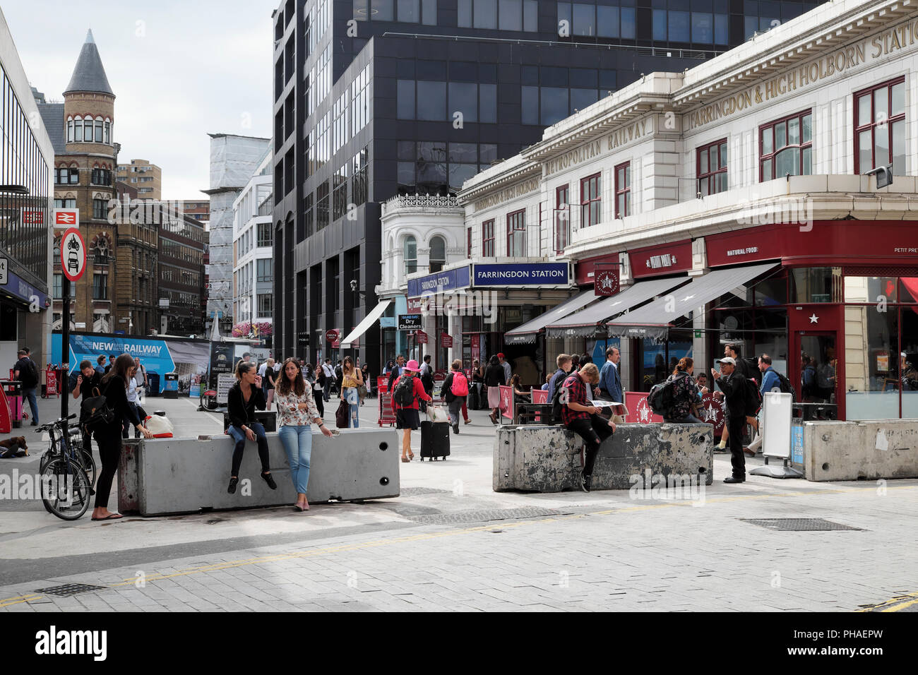 People in the street outside Farringdon Station Cow cross Lane in