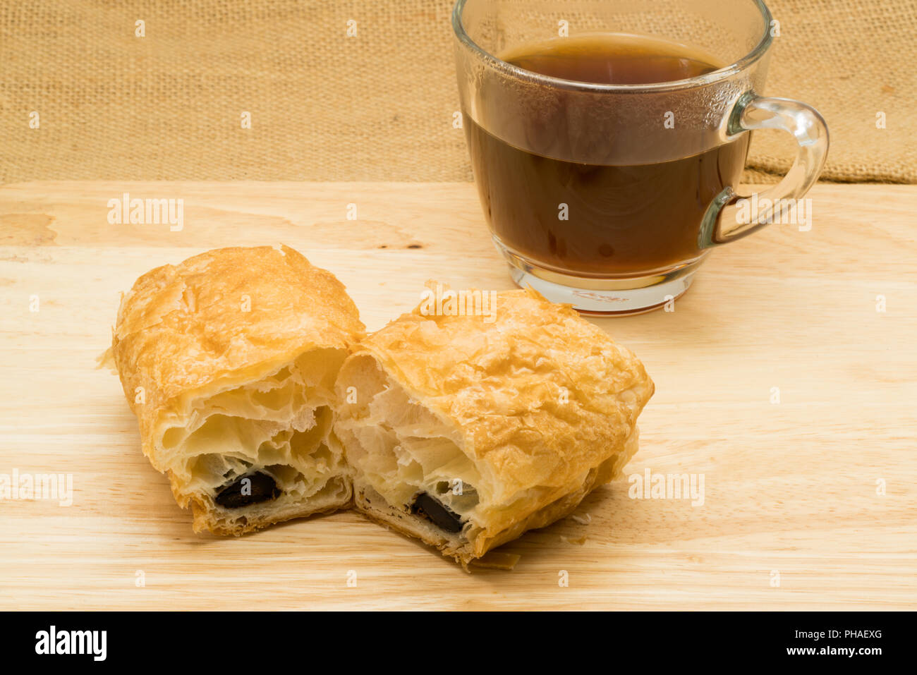 https://c8.alamy.com/comp/PHAEXG/chocolate-stick-filled-danish-and-a-cup-of-coffee-PHAEXG.jpg