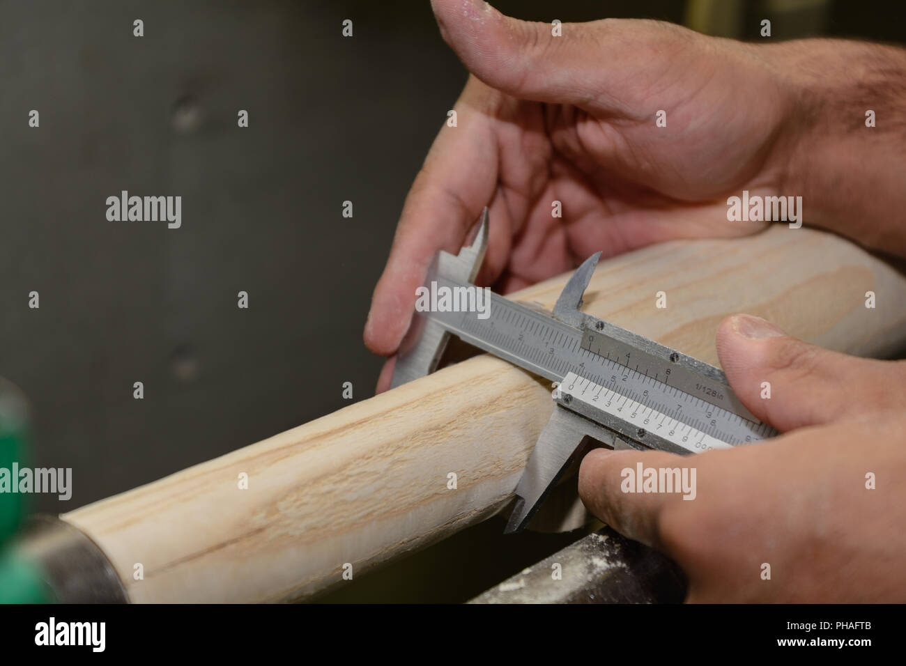 Carpenter with sliding regulator for woodwork - close-up Stock Photo