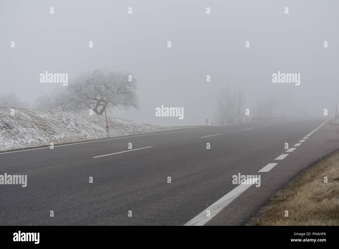 Dangerous driving conditions due to poor visibility in the fog Stock