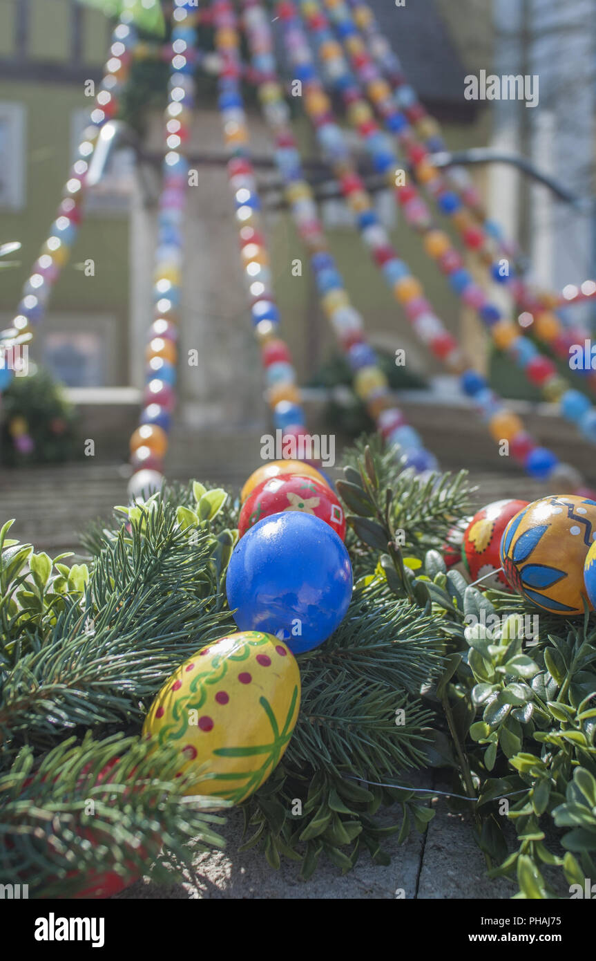 Decorated Water well with easter eggs in Langenburg, Germany Stock Photo