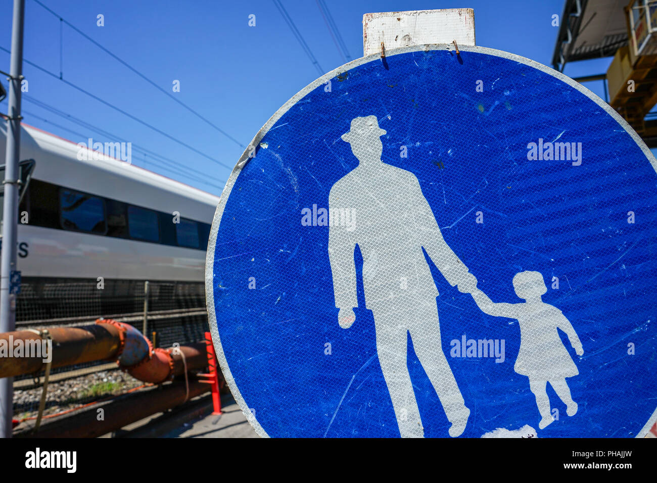 blue and white information sign with man and child Stock Photo Alamy