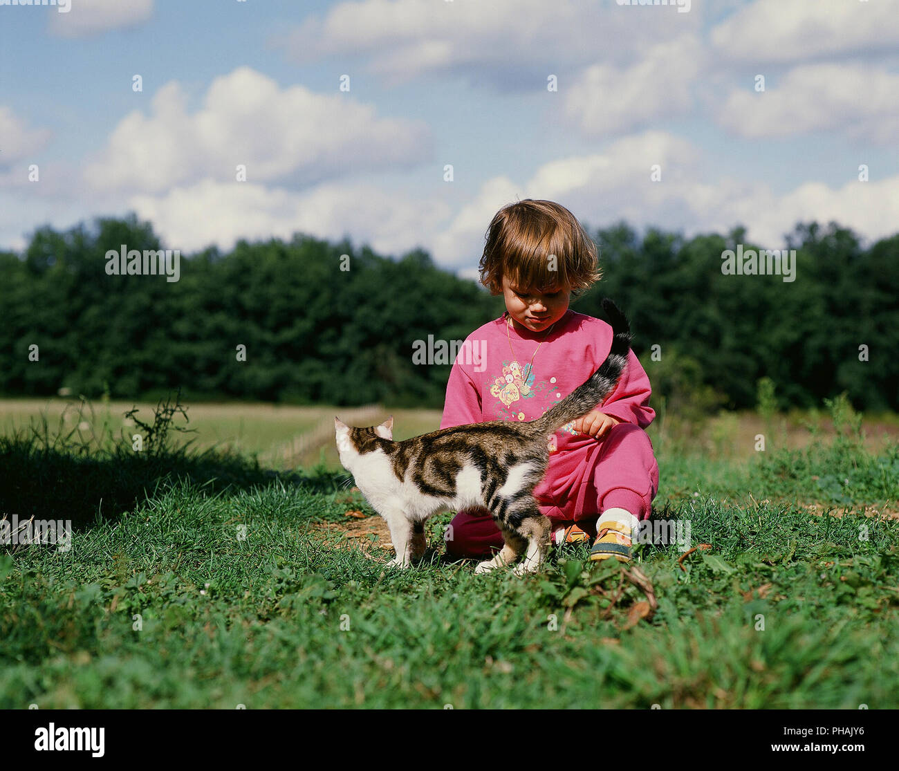 Enfant et chat - Child and cat Stock Photo