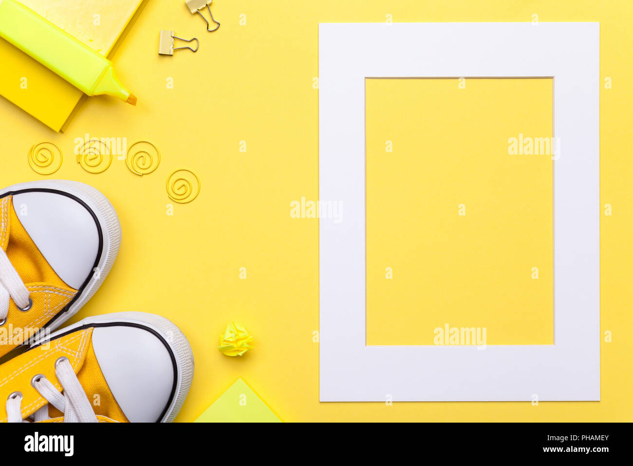 School Accessories with White Frame on Yellow Background Stock Photo
