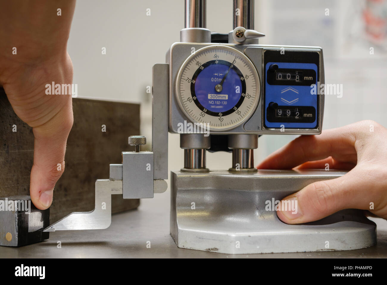 Precise metalworking with a height measuring device - close-up Stock Photo