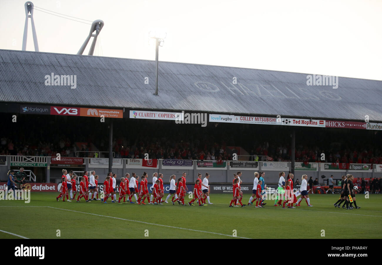 Wales Women and England Women players walk out for the FIFA Women's World Cup qualifying, group 1 match at Rodney Parade, Newport. Stock Photo