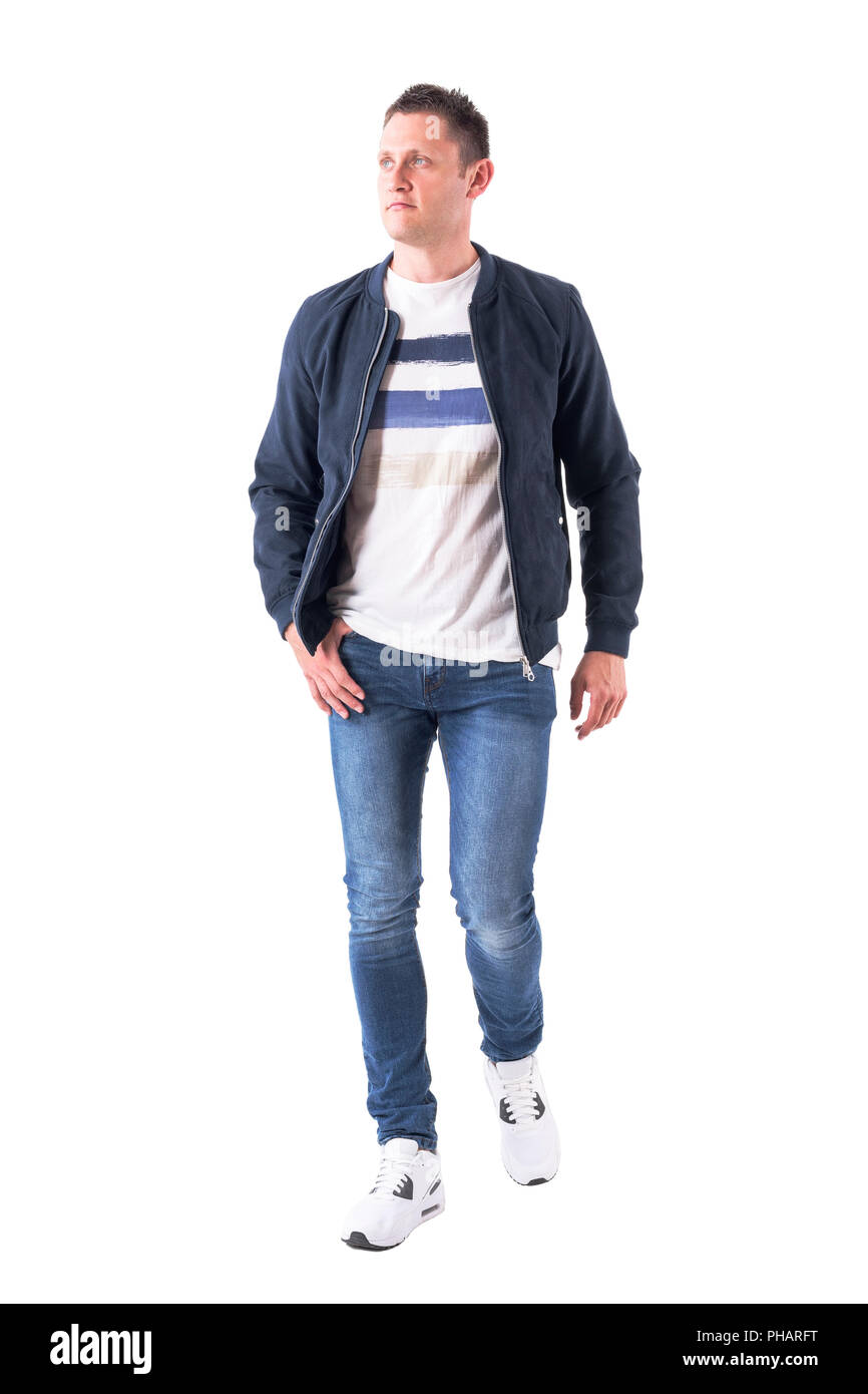 Front view of confident casual masculine man in jeans and jacket walking  and looking up. Full body isolated on white background Stock Photo - Alamy