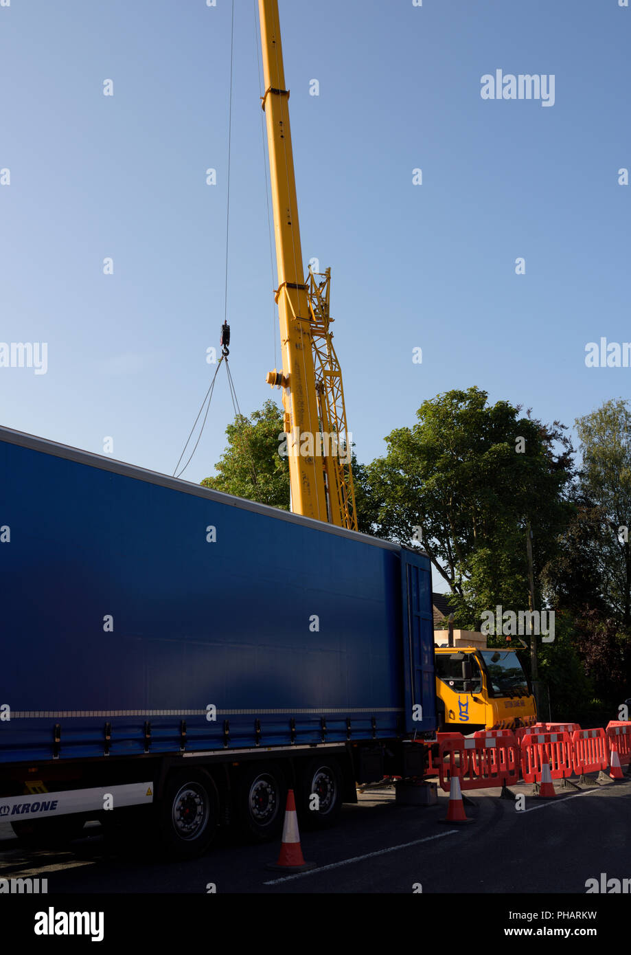 Elevated Hydraulic boom behind articulated lorry in whitefield