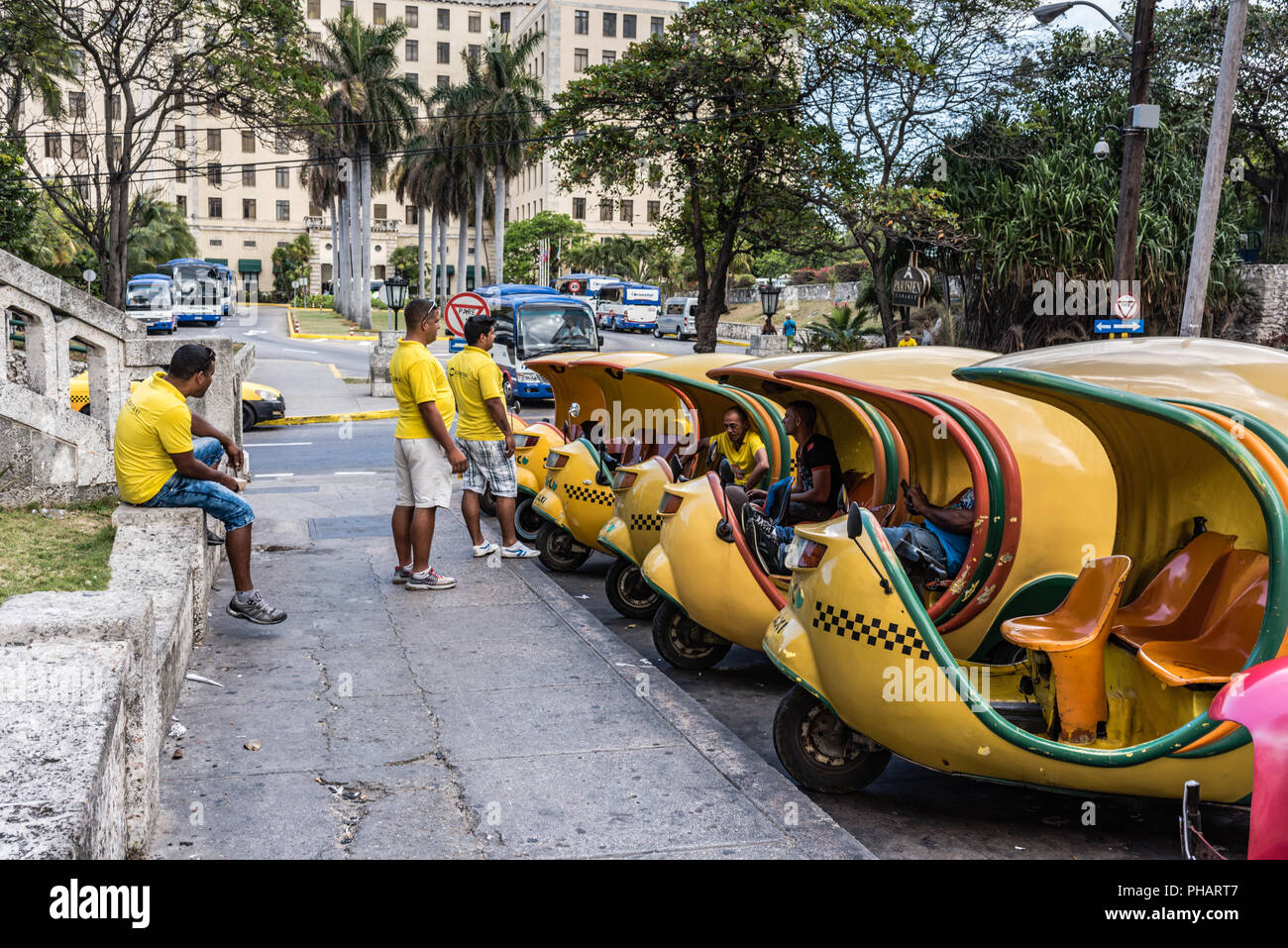 Havana, Cuba - March 14, 2016: Drivers await passengers at mini cab stand outside Hotel Nacional. Stock Photo