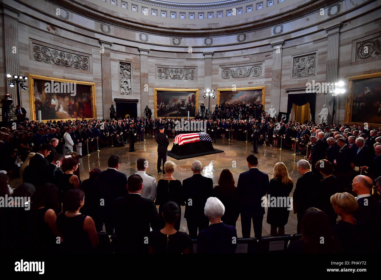 Mourners surround the casket of former Senator John McCain in the Capitol Rotunda where he will lie in state at the U.S. Capitol, in Washington, DC on Friday, August 31, 2018. McCain, an Arizona Republican, presidential candidate and war hero died August 25th at the age of 81. He is the 31st person to lie in state at the Capitol in 166 years. Photo by Kevin Dietsch/UPI | usage worldwide Stock Photo