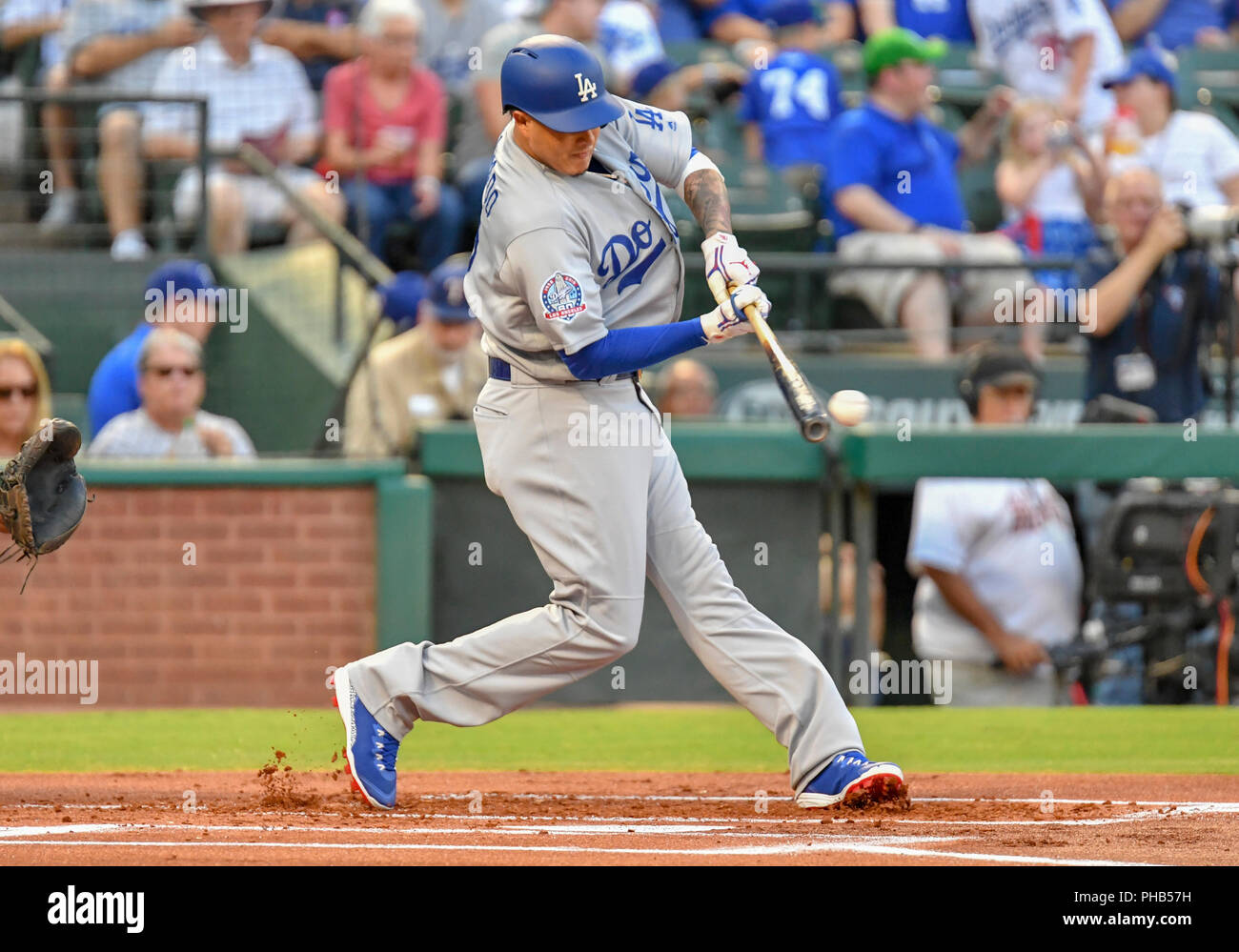 Aug 29, 2018: Los Angeles Dodgers third base Manny Machado #8 makes contact  with the ball during an interleague MLB game between the National League  Los Angeles Dodgers and the Texas Rangers