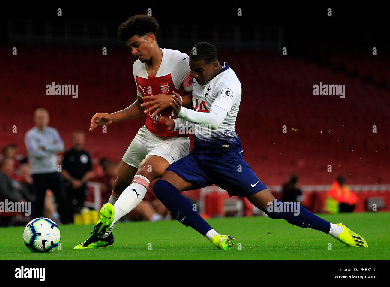 London, UK. 31st August 2018. Jaden Brown of Tottenham (R) in action with  Xavier Amaechi of Arsenal (L). PL2 match, Arsenal U23's v Tottenham Hotspur  U23's at the Emirates Stadium in London