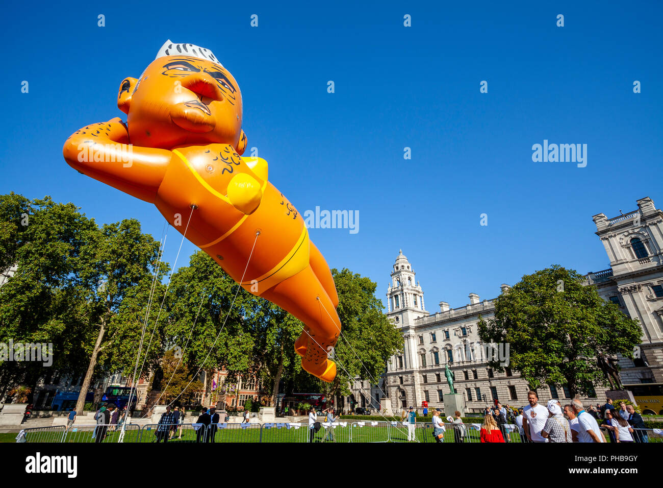 London, UK. 1st September 2018. Protesters fly a 29ft long bikini-clad blimp of London mayor Sadiq Khan over Parliament Square, Westminster. Credit: Grant Rooney/Alamy Live News Stock Photo