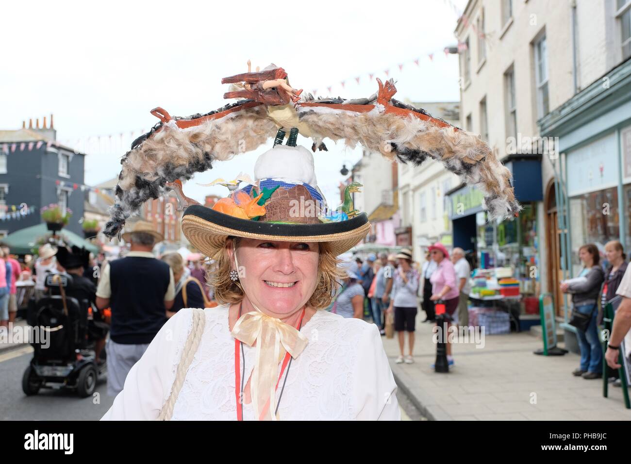 Bridport Hat Festival, Hat, Bridport, Dorset, UK. 1st September 2018.   Hat wearers gather and promenade in Bridport. The annual Bridport Hat Festival encourages residents and visitors to take part in hat related activities and and competitions including best hats, best hatted dog, and best hatted couple and most elegant ensemble. Credit:  Tom Corban/Alamy Live News Stock Photo