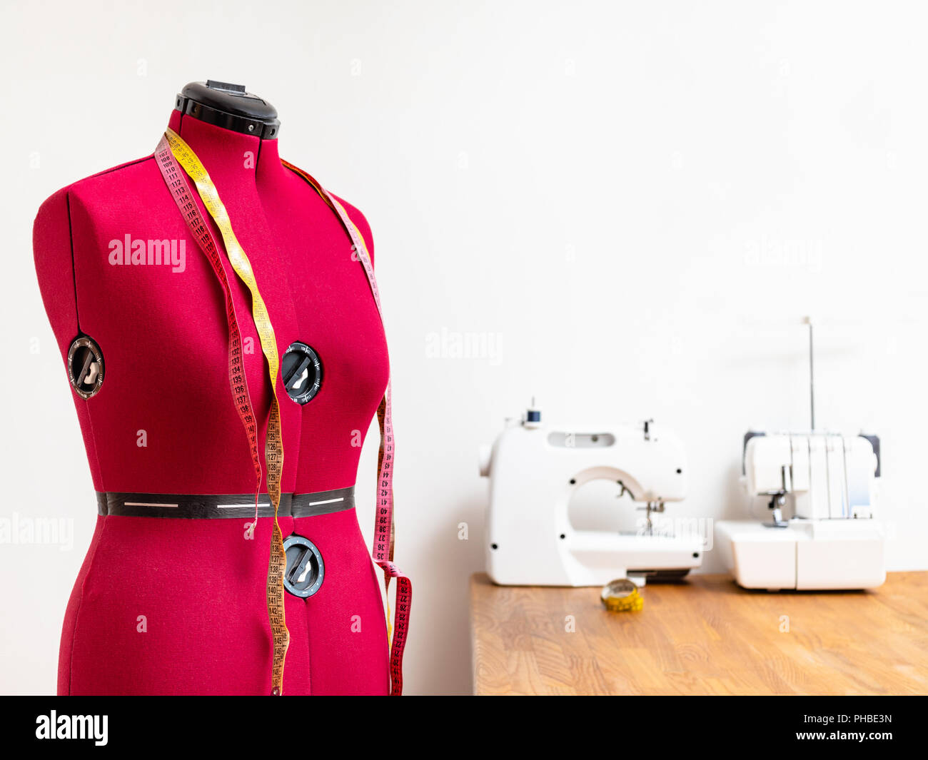 female form dummy with two measuring tapes in dressmaker Stock