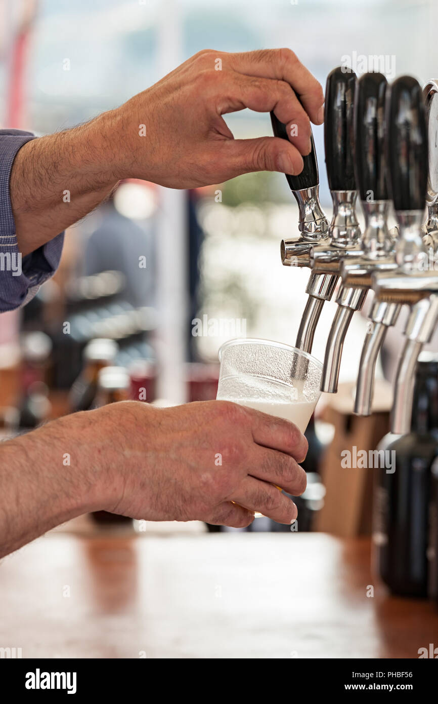 Pouring fresh beer Stock Photo