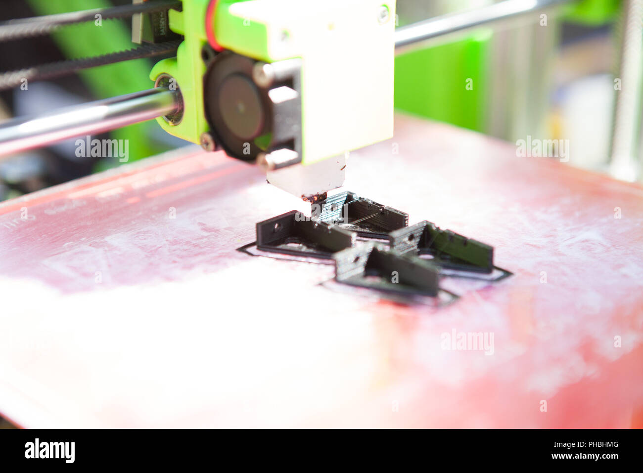 A desktop 3d printer in the laboratory for prints a structure from a polymer. Stock Photo