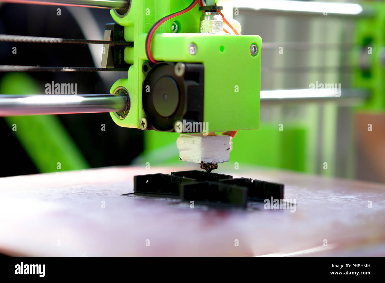 A desktop 3d printer in the laboratory for prints a structure from a polymer. Stock Photo