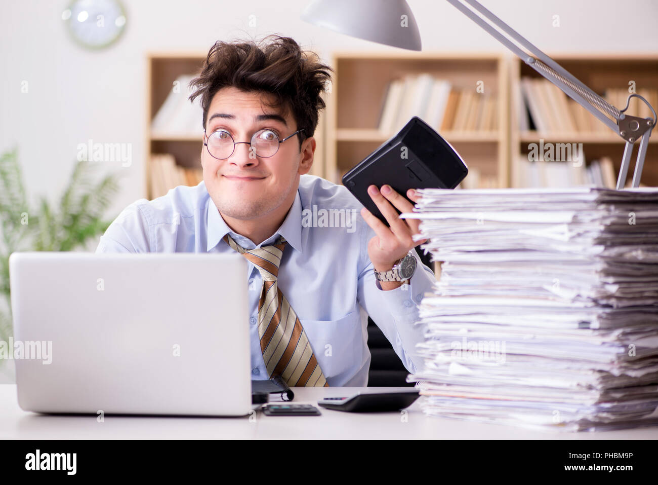 Funny accountant bookkeeper working in the office Stock Photo - Alamy