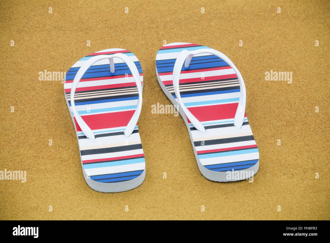Flip flops on the sandy beach Stock Photo - Alamy