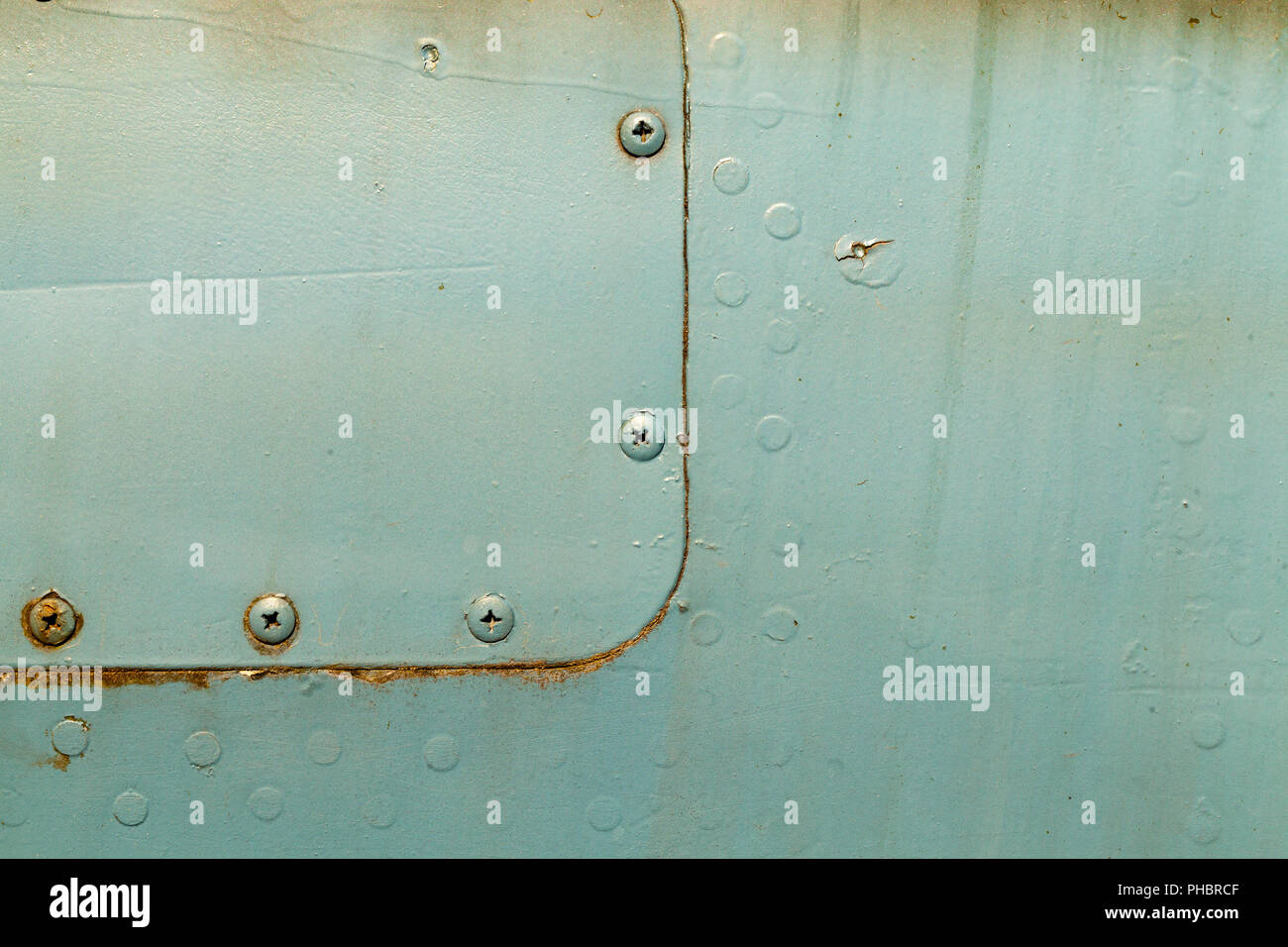 old green metal construction connected by aluminum rivets, used in ...