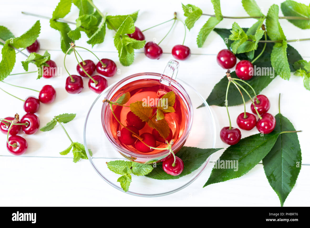 Fruit cherry drink in transparent glass cup Stock Photo