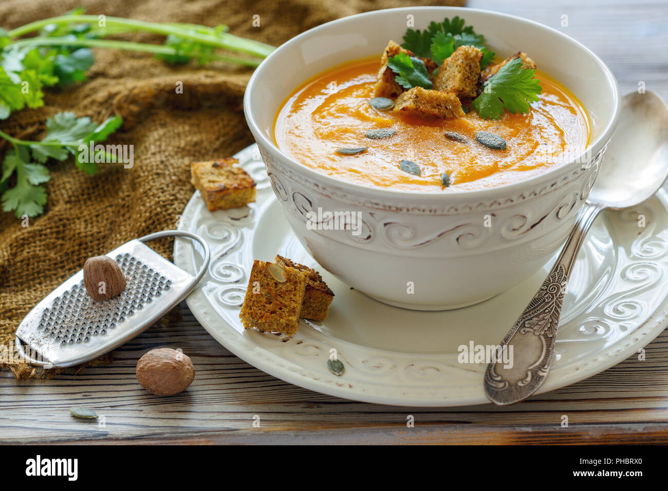 Pumpkin soup with croutons and spices. Stock Photo