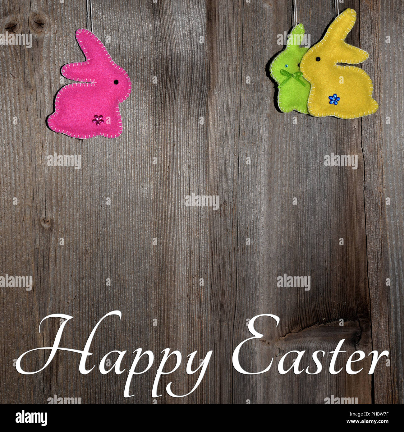 Easter bunny on wood background Stock Photo