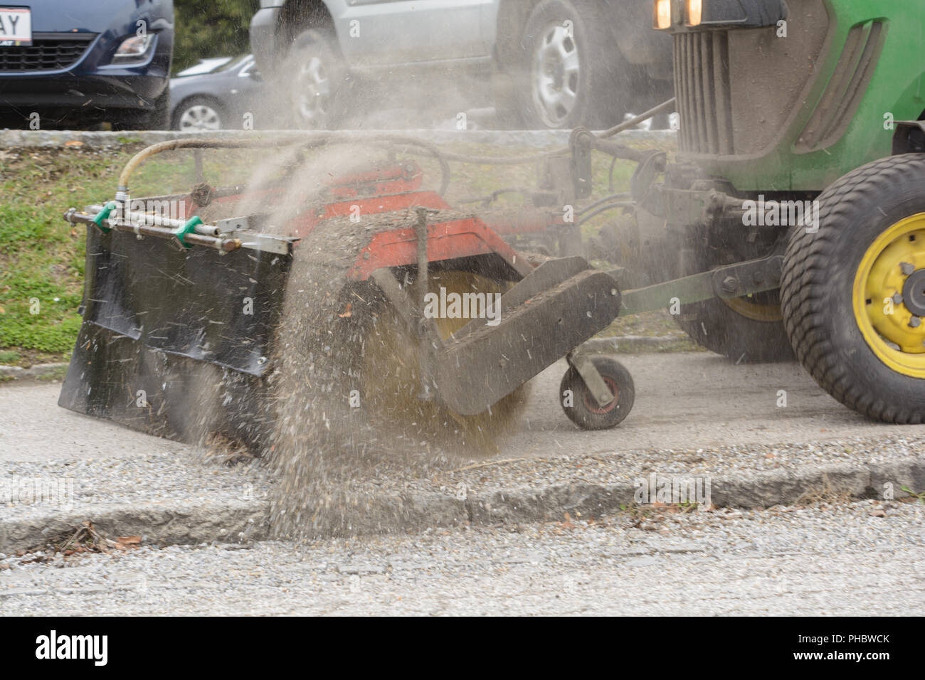 Cleaning the pavement with a sweeper Stock Photo