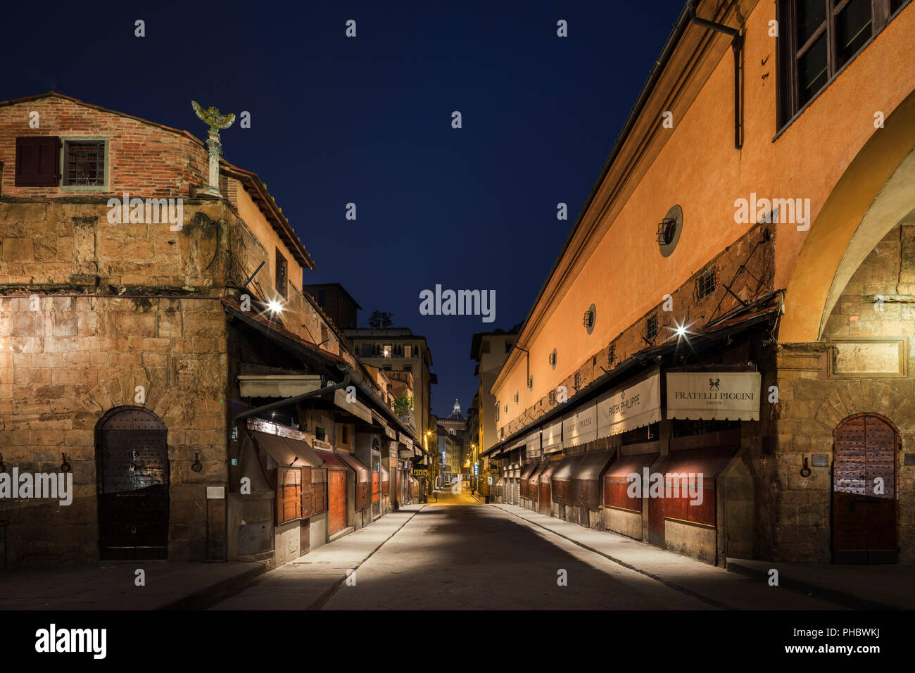 Looking along a deserted Ponte Vecchio to the Duomo in the early morning half light, Florence, Tuscany, Italy, Europe Stock Photo